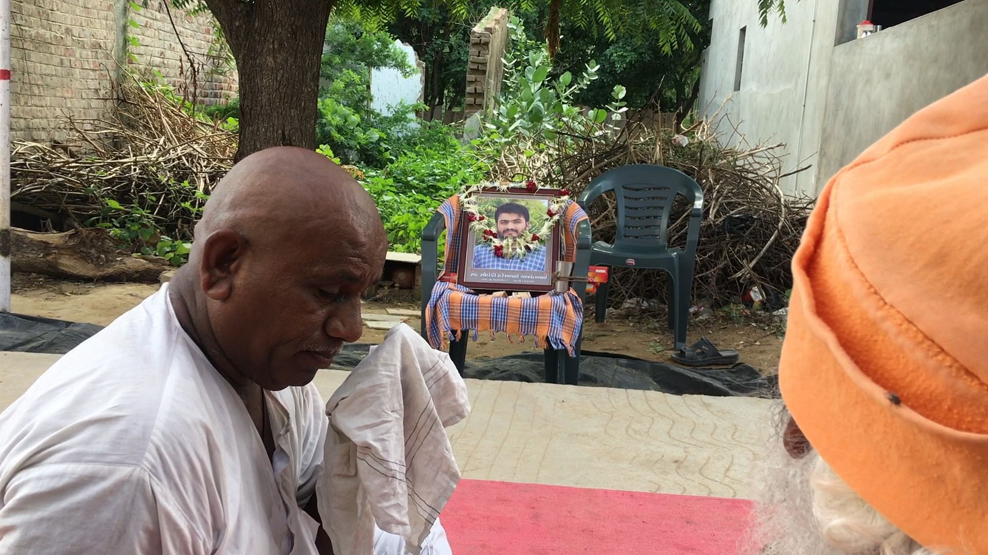 Yashwant Solanki mourns the death of his son, Haresh Solanki, in Varvada village in Mehsana, Gujarat.
