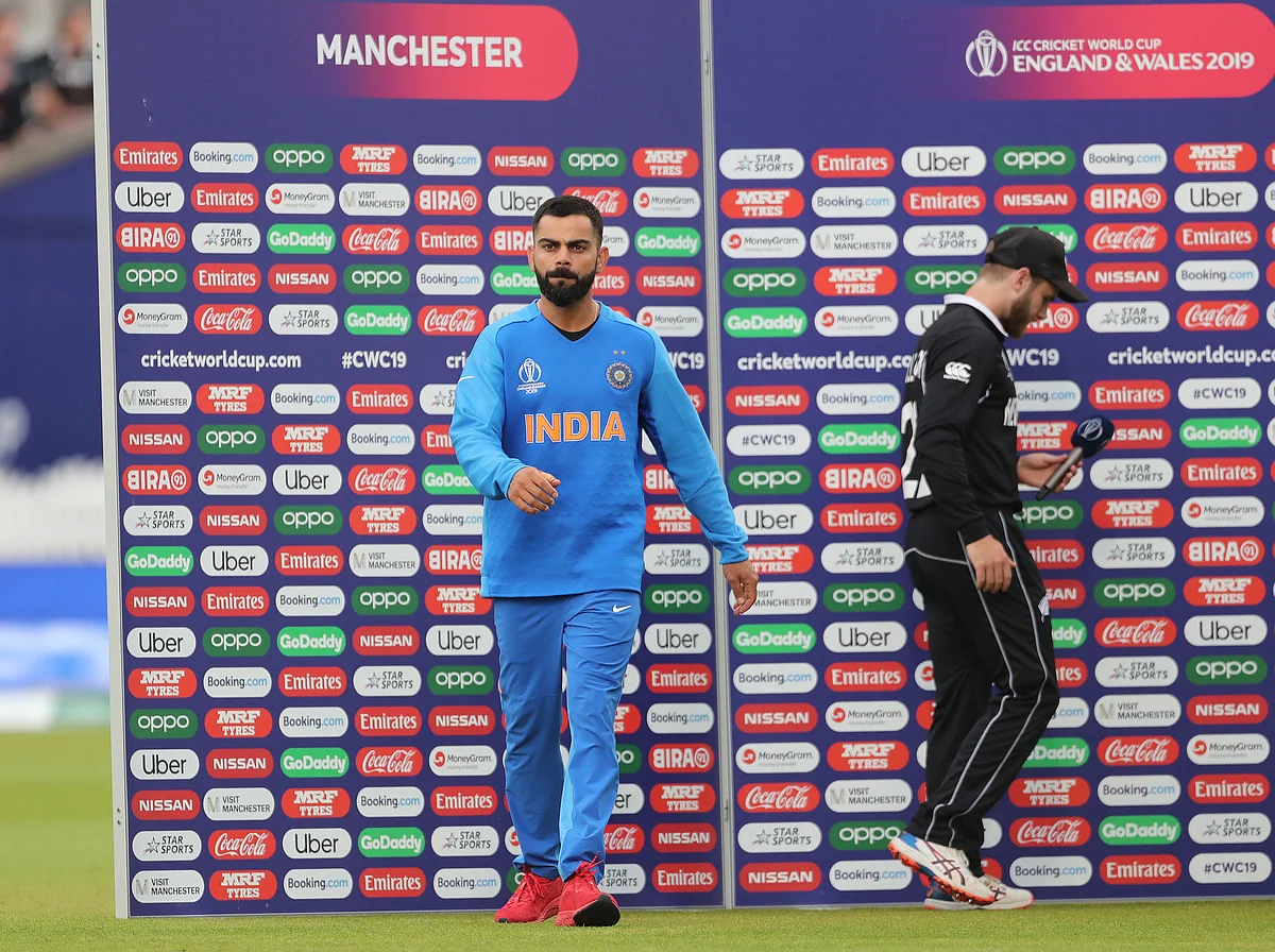 India’s captain Virat Kohli, left, walks away from New Zealand’s captain Kane Williamson, right, at the presentation ceremony after India’s loss in the Cricket World Cup semi-final match at Old Trafford in Manchester, England, Wednesday, July 10, 2019. 