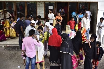 Guwahati: People wait outside the NRC hearing centre in Guwahati, on May 7, 2019. The complete draft published in July 2018 had excluded 40.07 lakh of the 3.29 crore applicants. (Photo: IANS)