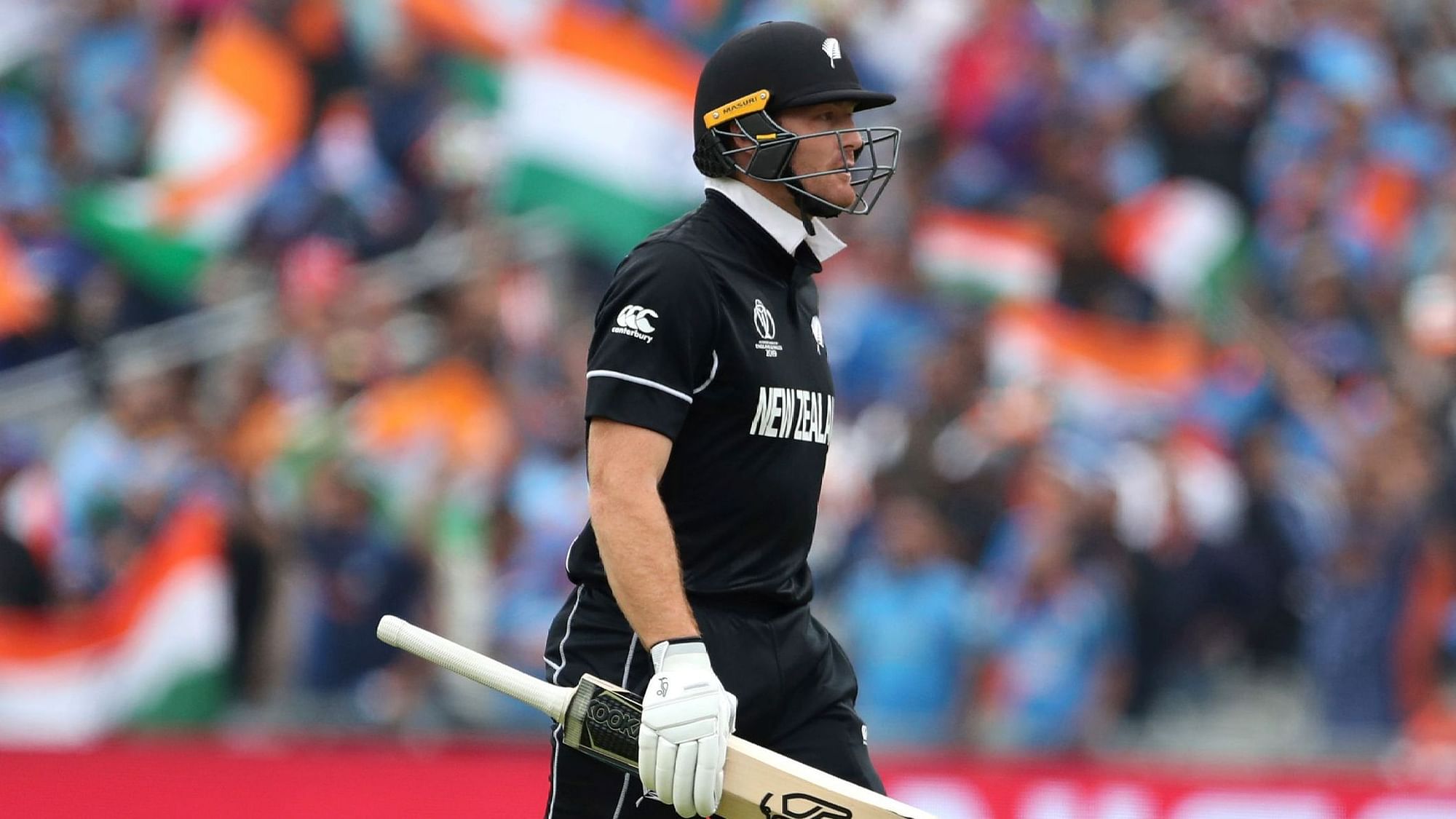New Zealand’s Martin Guptill leaves the field after being dismissed by India’s Jasprit Bumrah during the Cricket World Cup semi-final match between India and New Zealand.