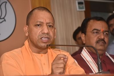 Lucknow: Uttar Pradesh Chief Minister Yogi Adityanath addresses a press conference at the state BJP headquarters in Lucknow, on May 24, 2019. Also seen Uttar Pradesh Deputy Chief Minister Keshav Prasad Maurya. (Photo: IANS)