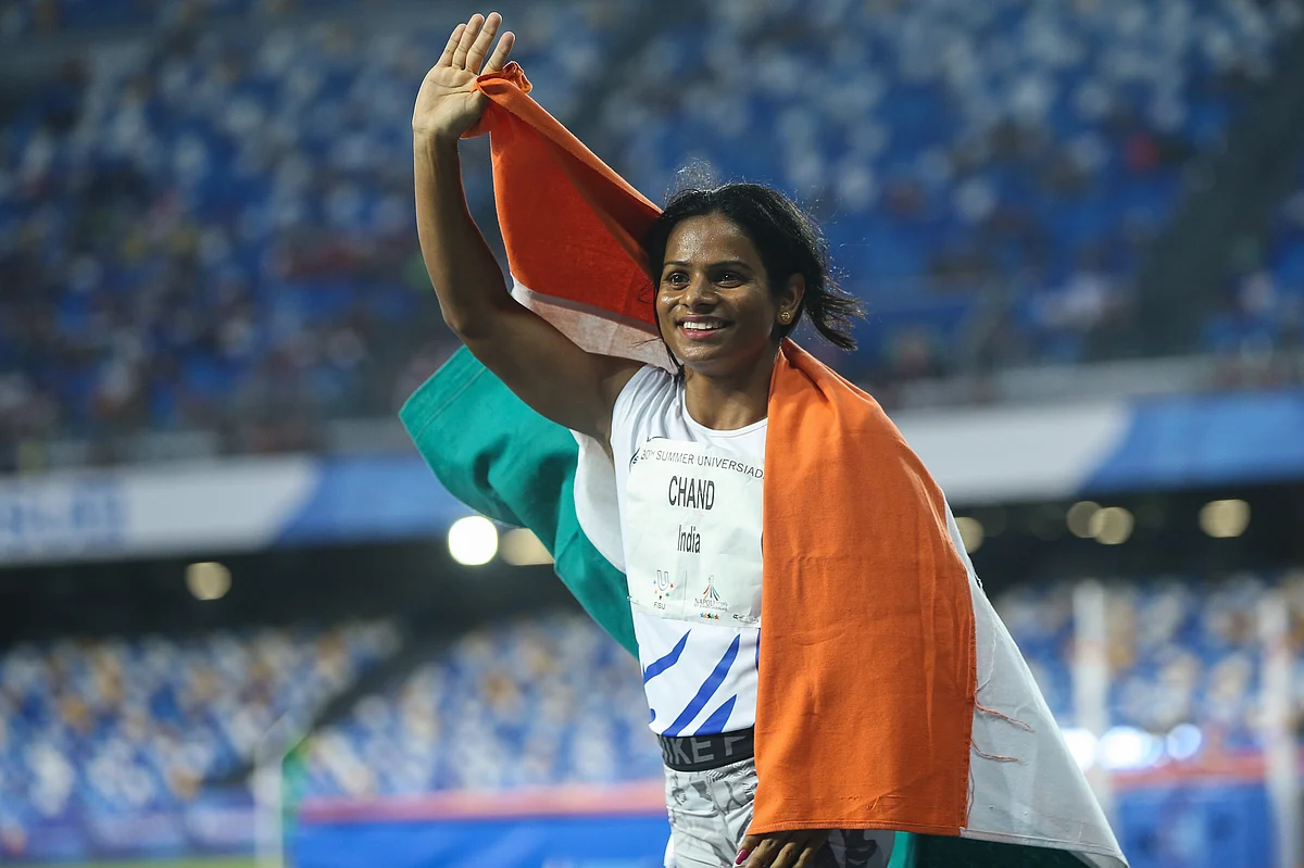 Dutee Chand celebrates her victory after the Women’s 100m Final at the 30th Summer Universiade in Naples.