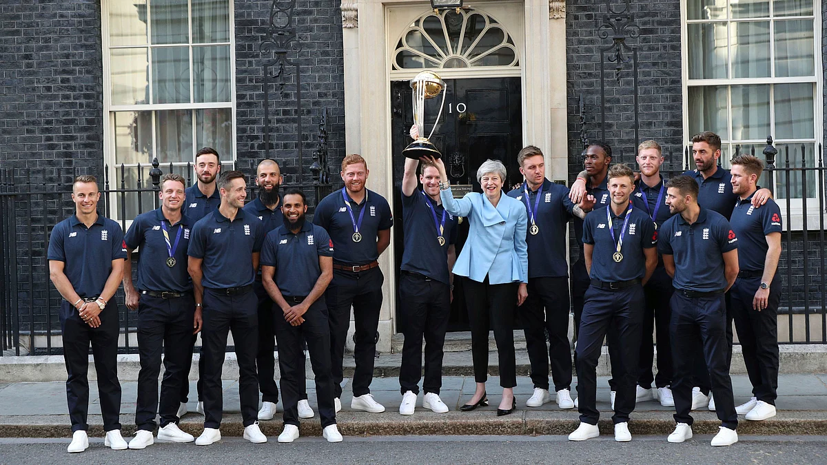 Former Britain’s Prime Minister Theresa May with England’s 2019 World Cup winning team.