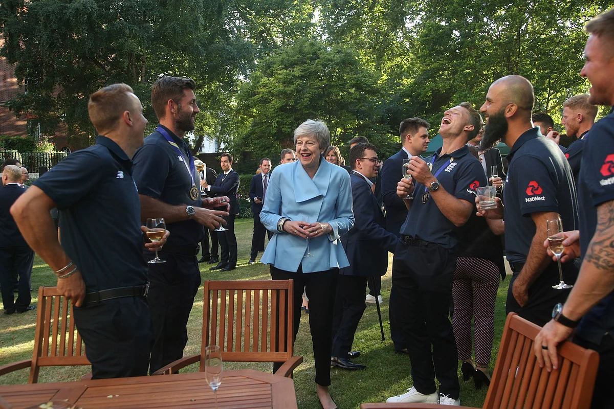 Britain’s Prime Minister Theresa May at her residence with the England cricket team after their win in the ICC World Cup 2019.