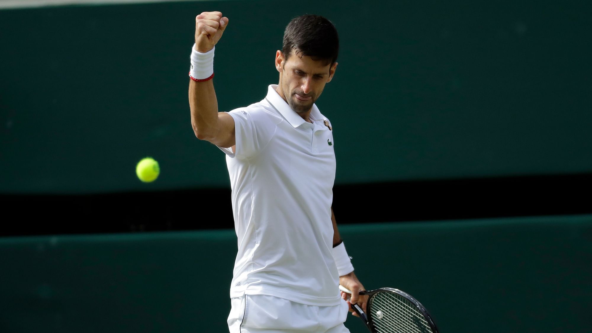 Defending champion Novak Djokovic beat Roger Federer 7-6 (5), 1-6, 7-6 (4), 4-6,