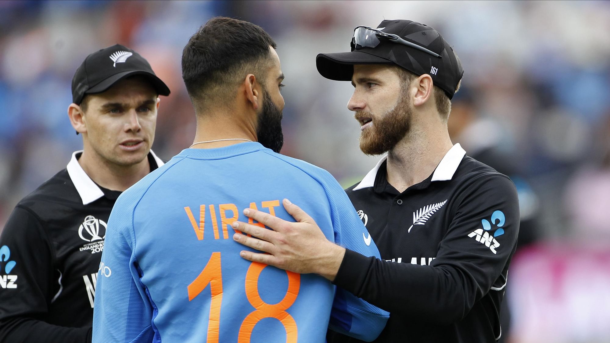 Kane Williamson is congratulated by Virat Kohli as New Zealand qualified for the 2019 World Cup final.