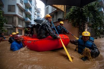 KATHMANDU, July 12, 2019 (Xinhua) -- Nepalese army personnel rescue local people after a heavy rainfall in Kathmandu, Nepal, July 12, 2019. Nepal was hit by heavy rainfall that caused floods and landslides in many places. (Xinhua/Sulav Shrestha/IANS)