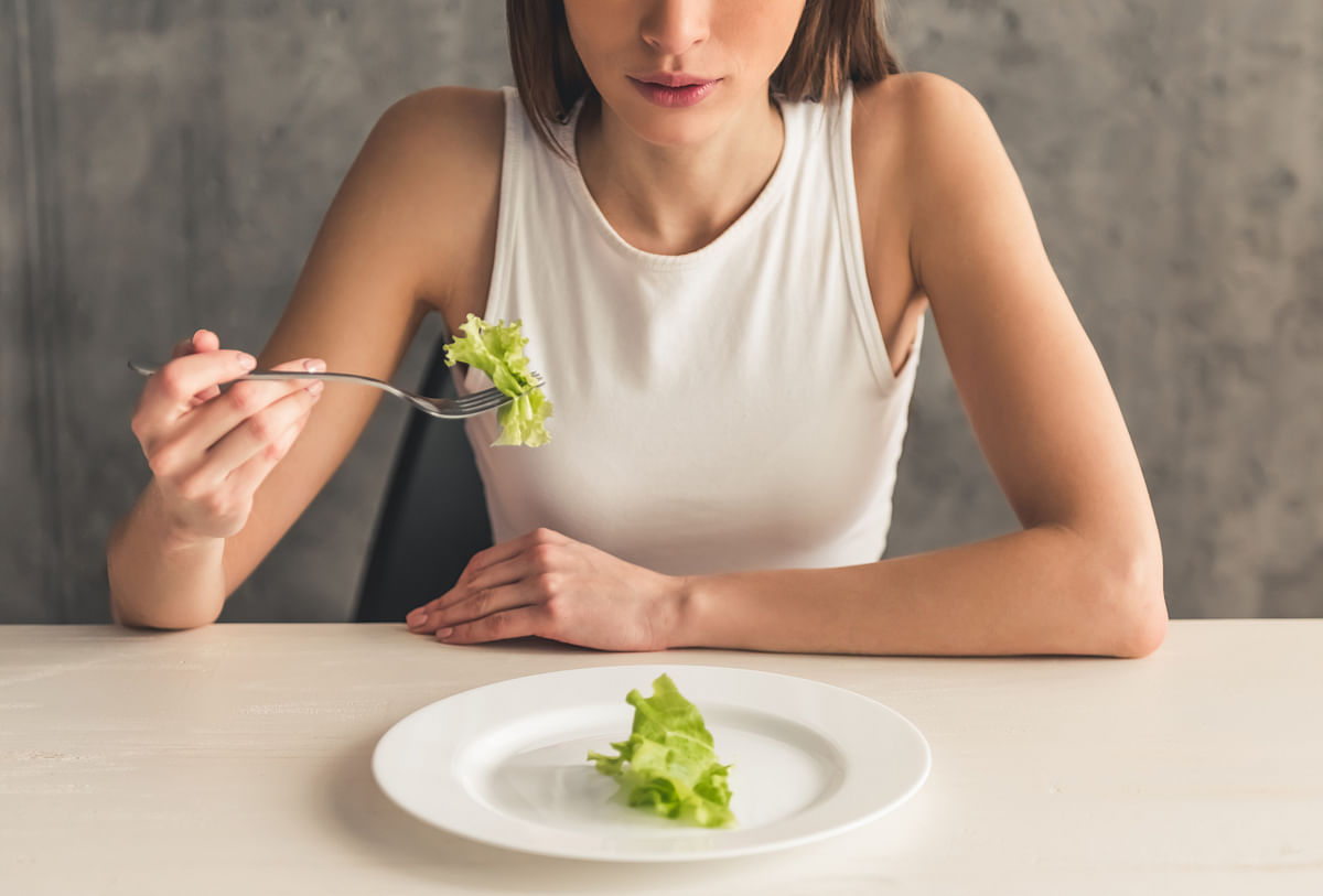 Denial and preoccupation with food and weight are the two most important signs of trouble for anorexic patients.
