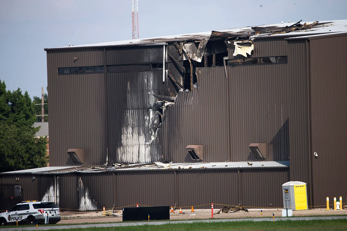 Damage is seen to a hangar after a twin-engine plane crashed into the building at Addison Airport in Addison, Texas, Sunday.