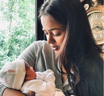Actress Sameera Reddy who welcomed her second baby recently says she prayed for a baby girl. Sameera on Monday shared a glimpse of the new-born on Instagram. In the image, she is seen cradling the baby in her arms. (Photo: Instagram/reddysameera)