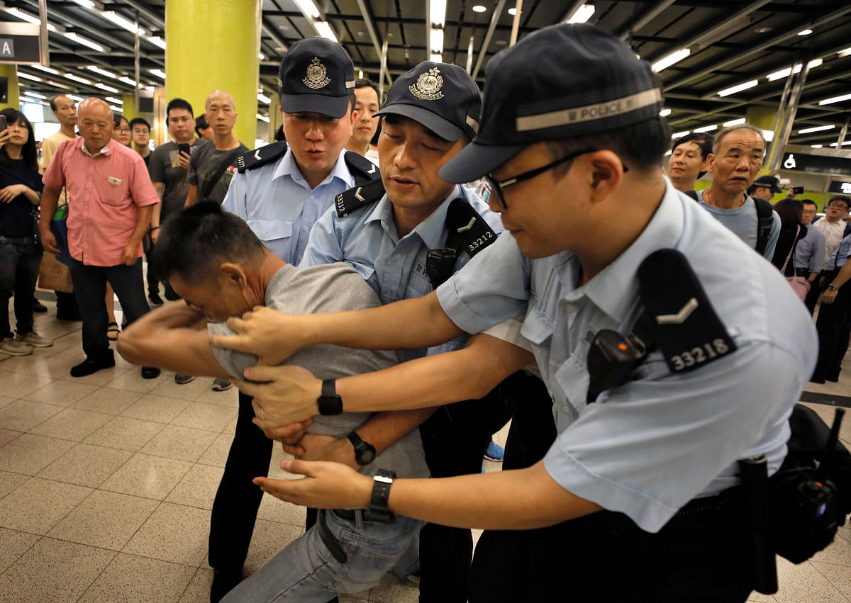Hong Kong police said  that the protesters set up roadblocks, broke fences and attacked police officers.