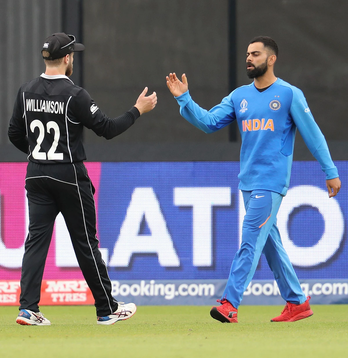 India’s captain Virat Kohli, right, congratulates New Zealand’s captain Kane Williamson for winning their Cricket World Cup semifinal match at Old Trafford in Manchester, Wednesday, July 10, 2019. 