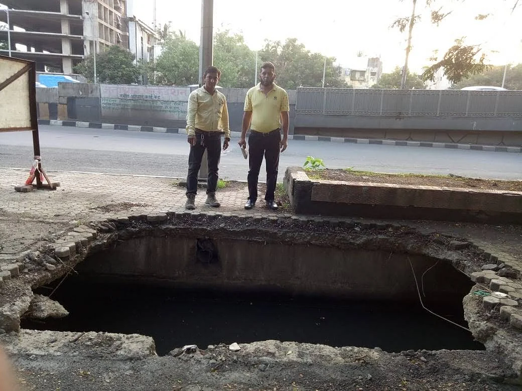 A sunken manhole at Bandra East WeH, opposite Gandhi Nagar building. 