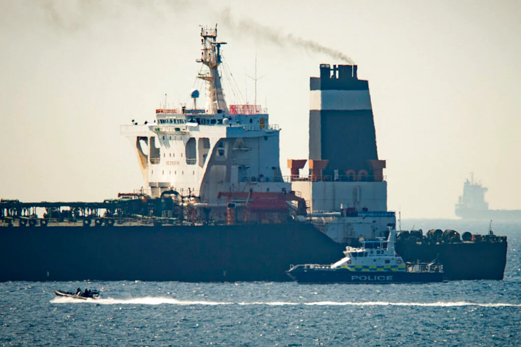 In this Thursday, July 4, 2019 file photo, a Royal Marine patrol vessel is seen beside the Grace 1 super tanker in the British territory of Gibraltar.