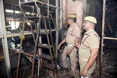 Chennai: Police personnel at the Harbour Telephone Exchange of the Bharat Sanchar Nigam Ltd (BSNL) where a fire broke out affecting mobile, landline and broadband connectivity in the area, in Chennai on Aug 1, 2019. (Photo: IANS)
