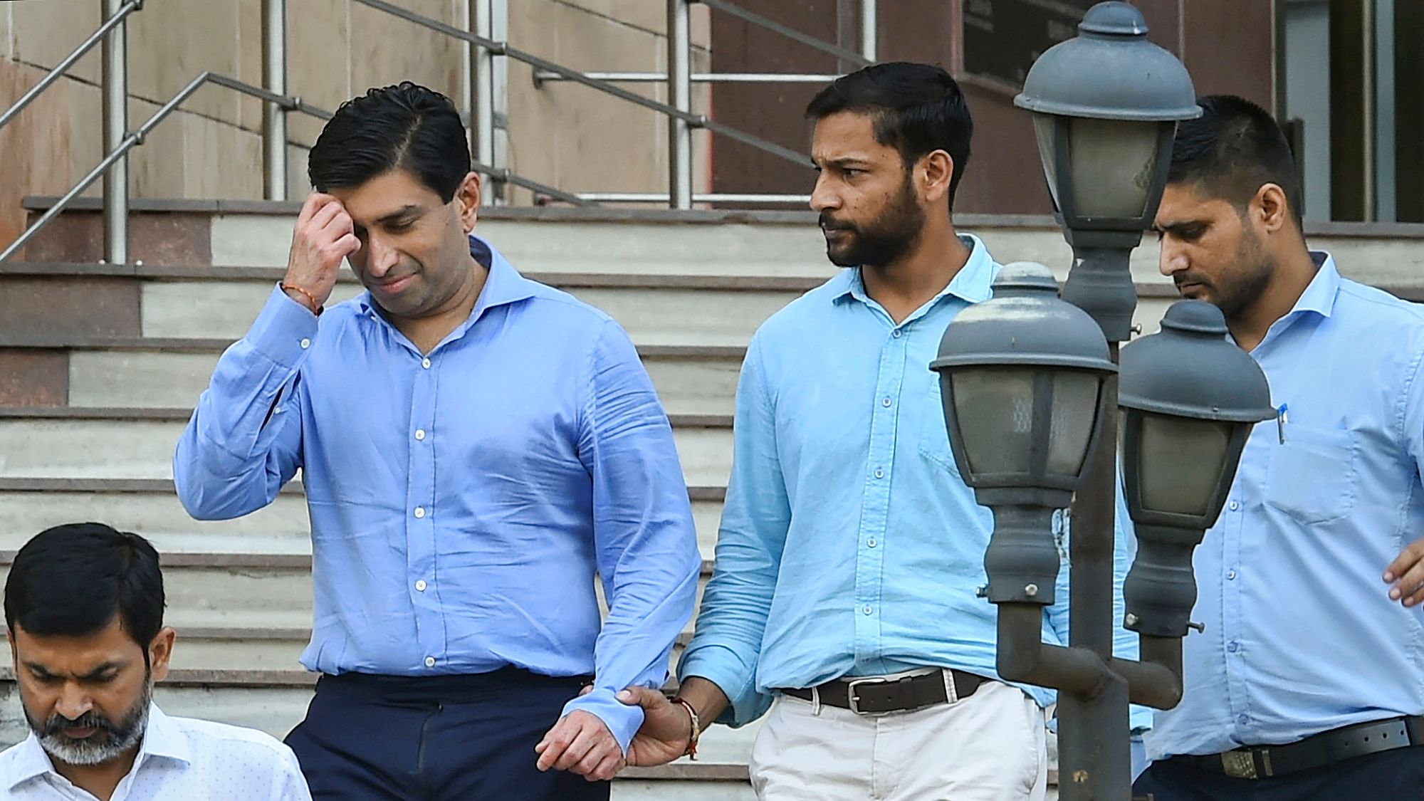 Ratul Puri (L) leaves the ED office after being arrested in connection with a Rs 354 crore bank loan fraud case, in New Delhi, on 20 Aug 2019.&nbsp;