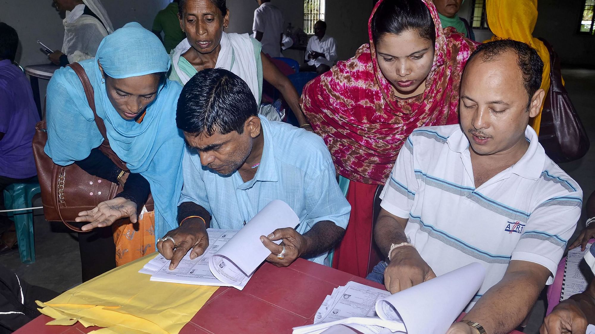 People check their names on the NRC final list at an NRC centre in Buraburi Gaon, Morigaon, Assam on 31 August.&nbsp; &nbsp;