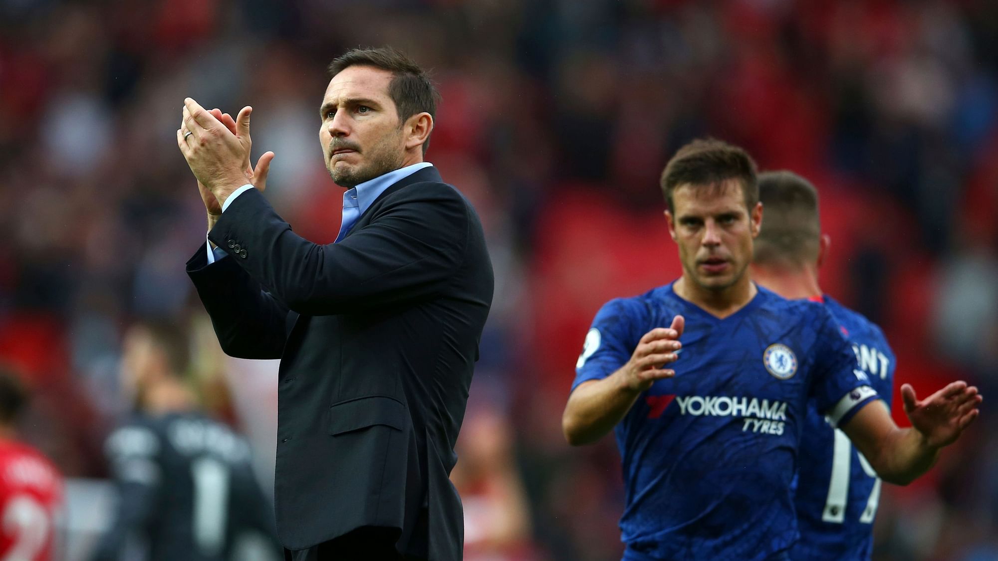 Chelsea’s head coach Frank Lampard, left, and Chelsea’s Cesar Azpilicueta acknowledge spectators after the English Premier League soccer match between Manchester United and Chelsea at Old Trafford in Manchester, England, Sunday, Aug. 11, 2019.&nbsp;