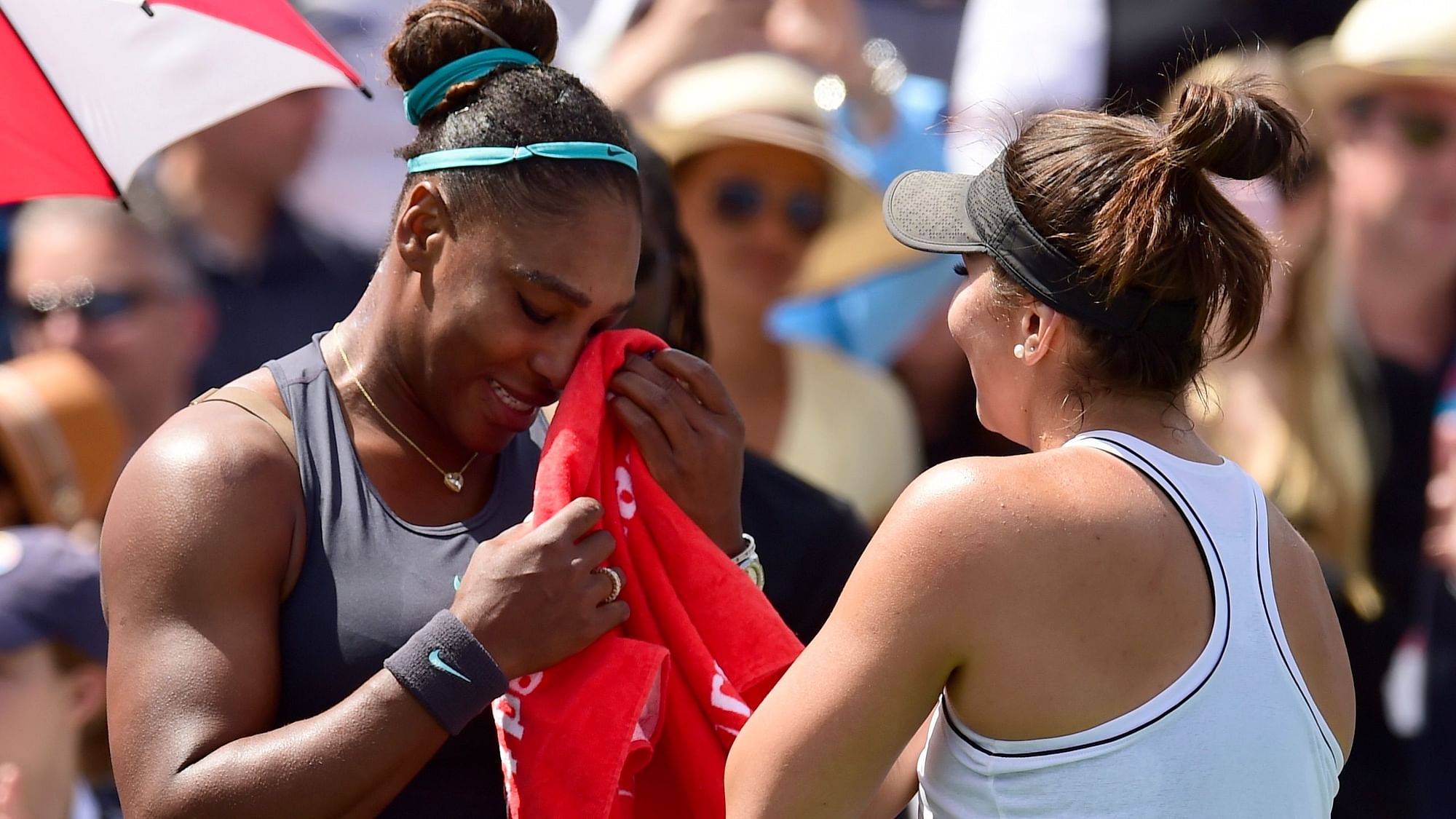 Canada’s Bianca Andreescu, right, consoles Serena Williams, of the United States, after Williams had to retire from the final of the Rogers Cup tennis tournament in Toronto, Sunday, Aug. 11, 2019.