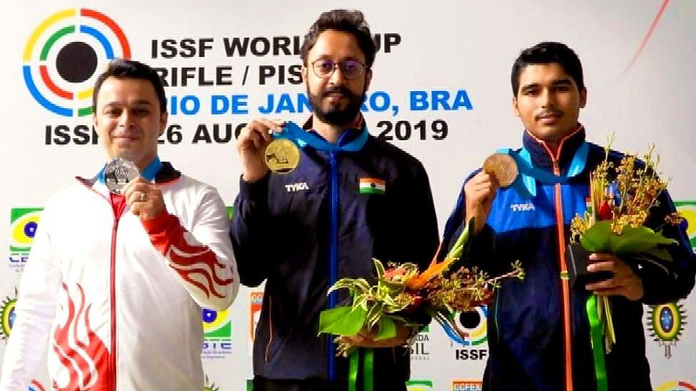Abhishek Verma (centre) and Saurabh Chaudhary (right) with their respective mesals on the podium in the men’s 10m air pistol event of the ongoing ISSF World Cup in Rio de Janerio.