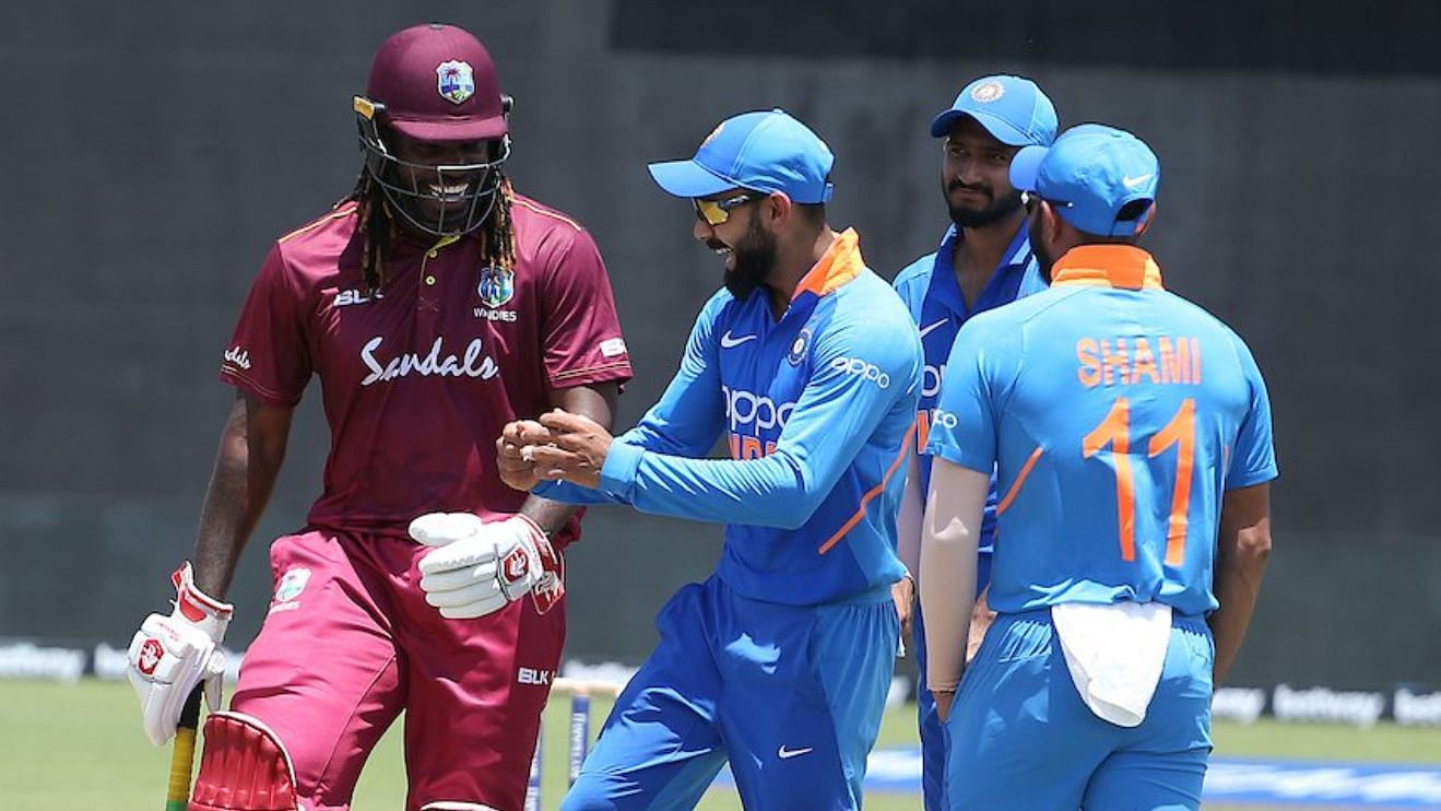 Chris Gayle and Virat Kohli during the first ODI between India and West Indies at Guyana.