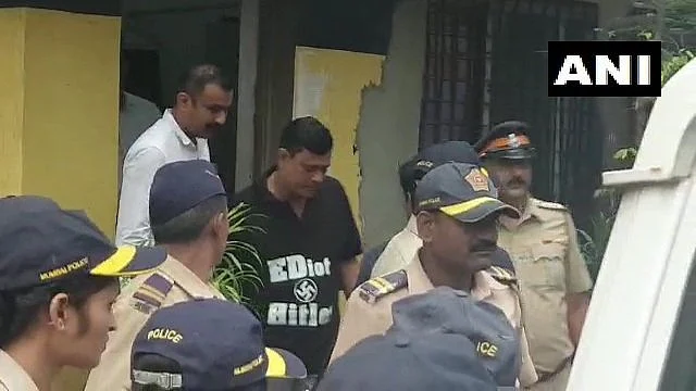 MNS leader Sandeep Deshpande, wearing a tee shirt with “EDiot Hitler” emblasoned on it, taken into custody by police.