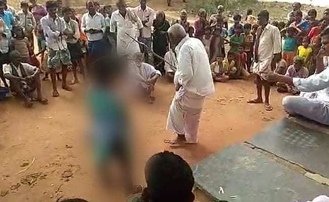 70-year-old Boya Linganna hits a 17-year-old minor girl with a stick in full public view after she eloped with her 20-year-old cousin
