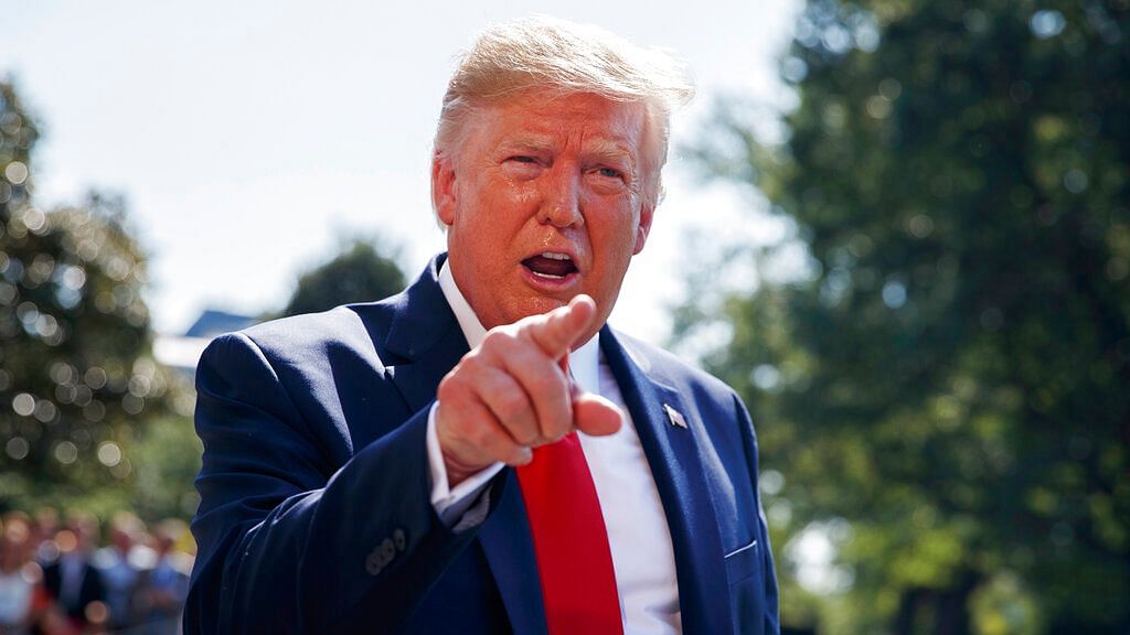 US President Donald Trump talks to reporters on the South Lawn of the White House in Washington on 9 Aug 2019.