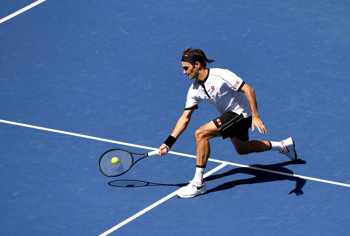 Roger Federer rolled into the fourth round with a 6-2, 6-2, 6-1 victory over Dan Evans of Britain.