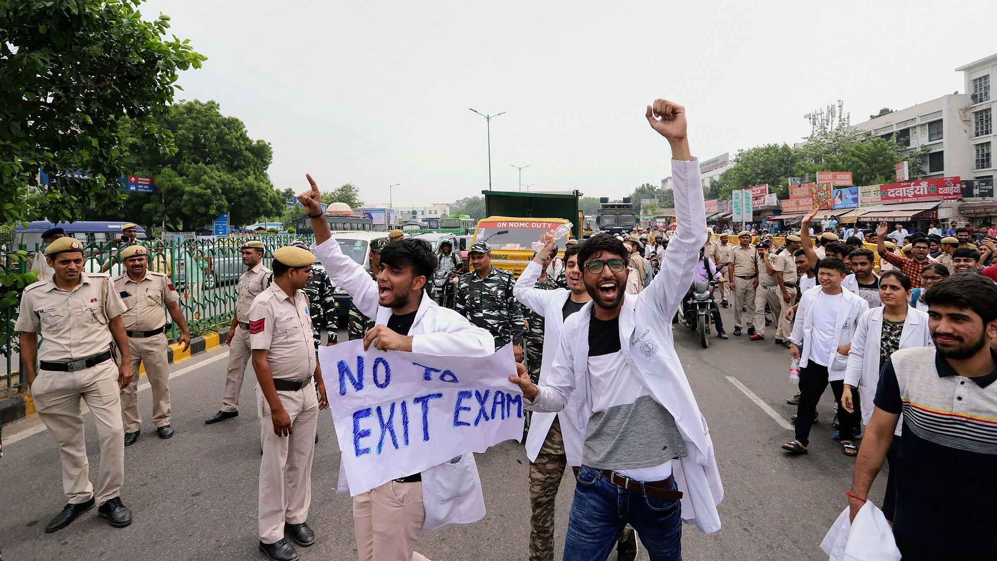 Doctors and medical students raise slogans during a protest against the passage of National Medical Commission  Bill outside AIIMS in New Delhi on Saturday, 3 August.&nbsp;