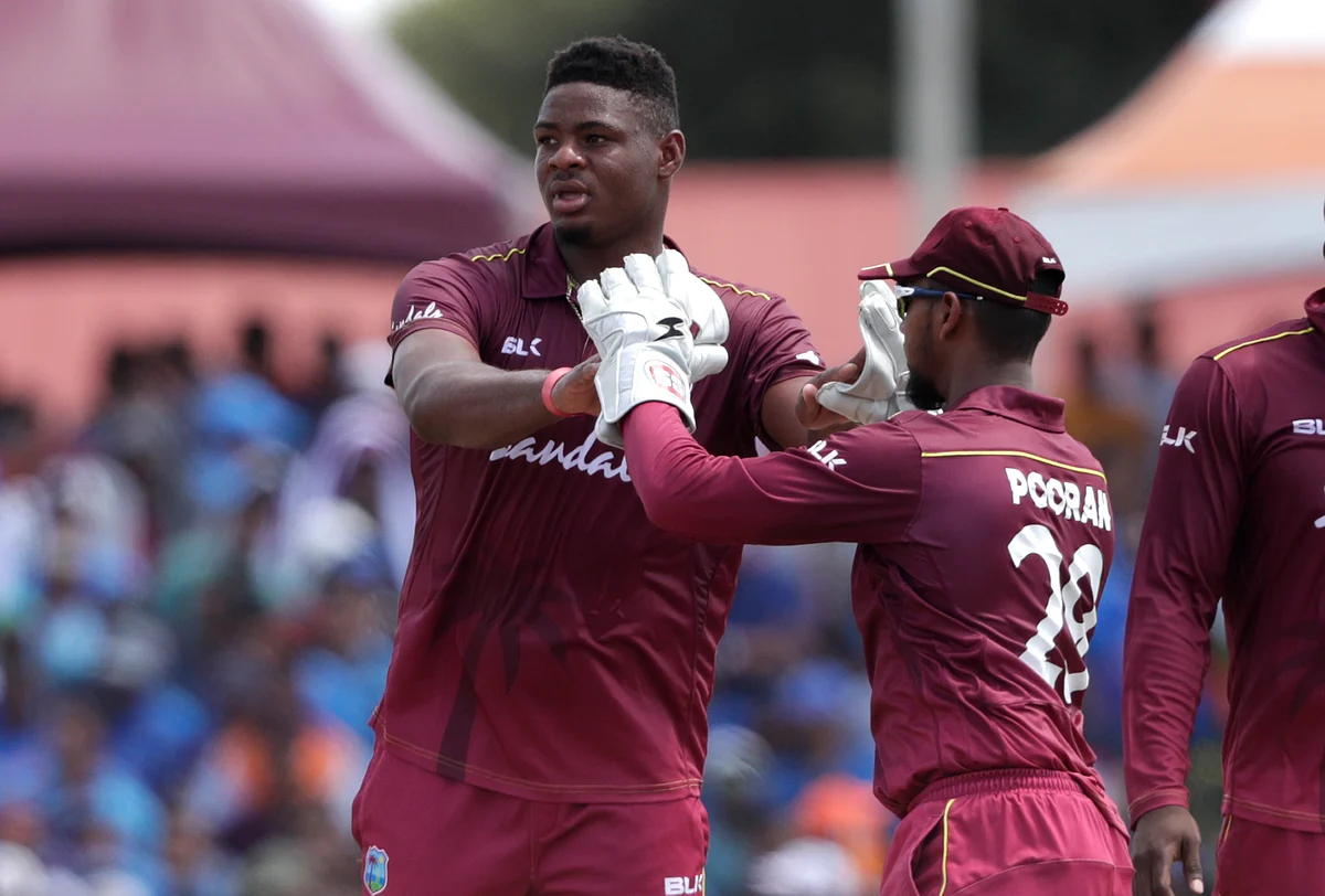 West Indies’ Keemo Paul, left, is congratulated by Nicholas Pooran after taking the wicket of India’s Rishabh Pant during a Twenty20 international in India.
