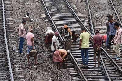 Workers busy in ongoing repair works on railway tracks. (File Photo: IANS)