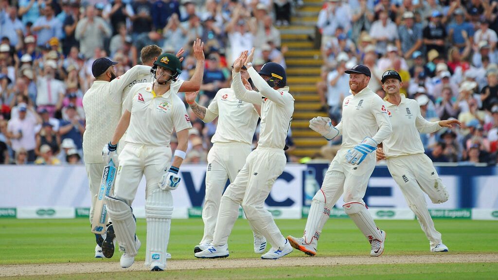 England’s cricketers celebrate the dismissal of Australia’s cricket captain Tim Paine during day one of the first Ashes Test cricket match between England and Australia at Edgbaston in Birmingham on 1 August 2019.
