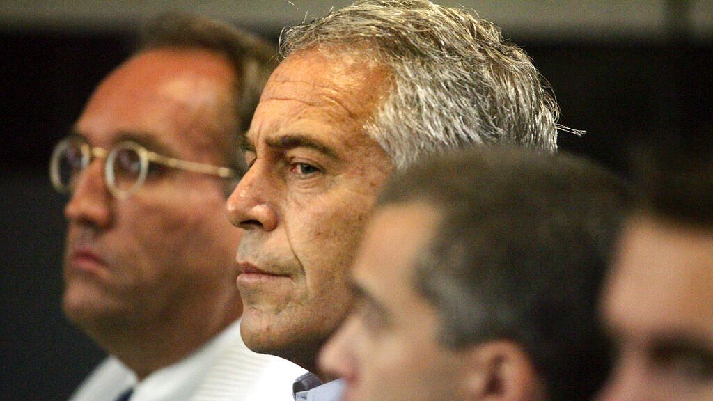 In this 30 July, 2008, file photo, Jeffrey Epstein, center, appears in court in West Palm Beach.