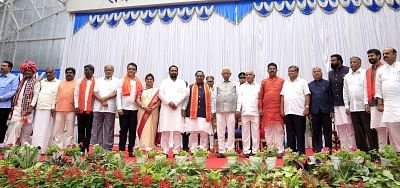 Bengaluru: Karnataka Governor Vajubhai Vala and  Chief Minister B. S. Yediyurappa with the 17 newly sworn-in Cabinet Ministers at Raj Bhavan in Bengaluru on Aug 20, 2019. (Photo: IANS)