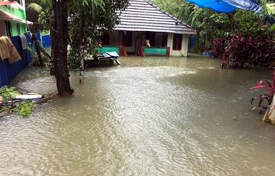 Kottayam : A view of a flooded house at Kottayam of Kerala after heavy rains lashed the city,on July 19, 2018. (Photo: IANS)