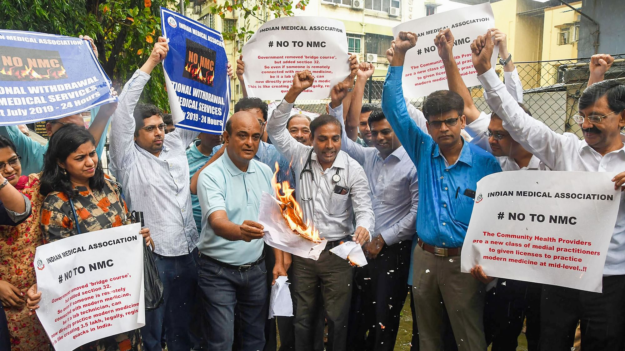 Junior doctors and medical students hold placards as they protest against the National Medical Commission (NMC) Bill-2019