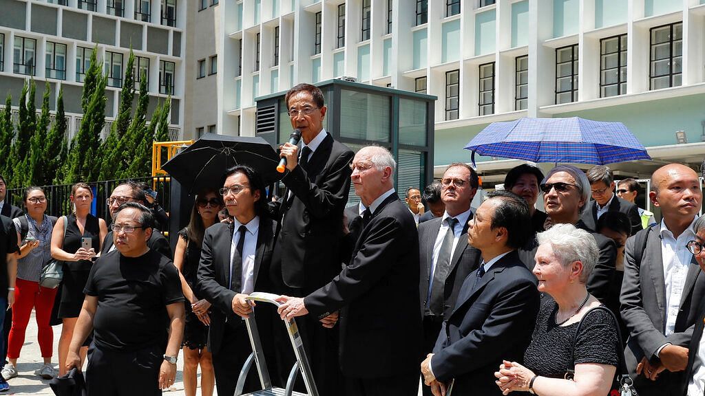 Veteran democracy activist Martin Lee (centre) speaks during a protest march by lawyers in Hong Kong