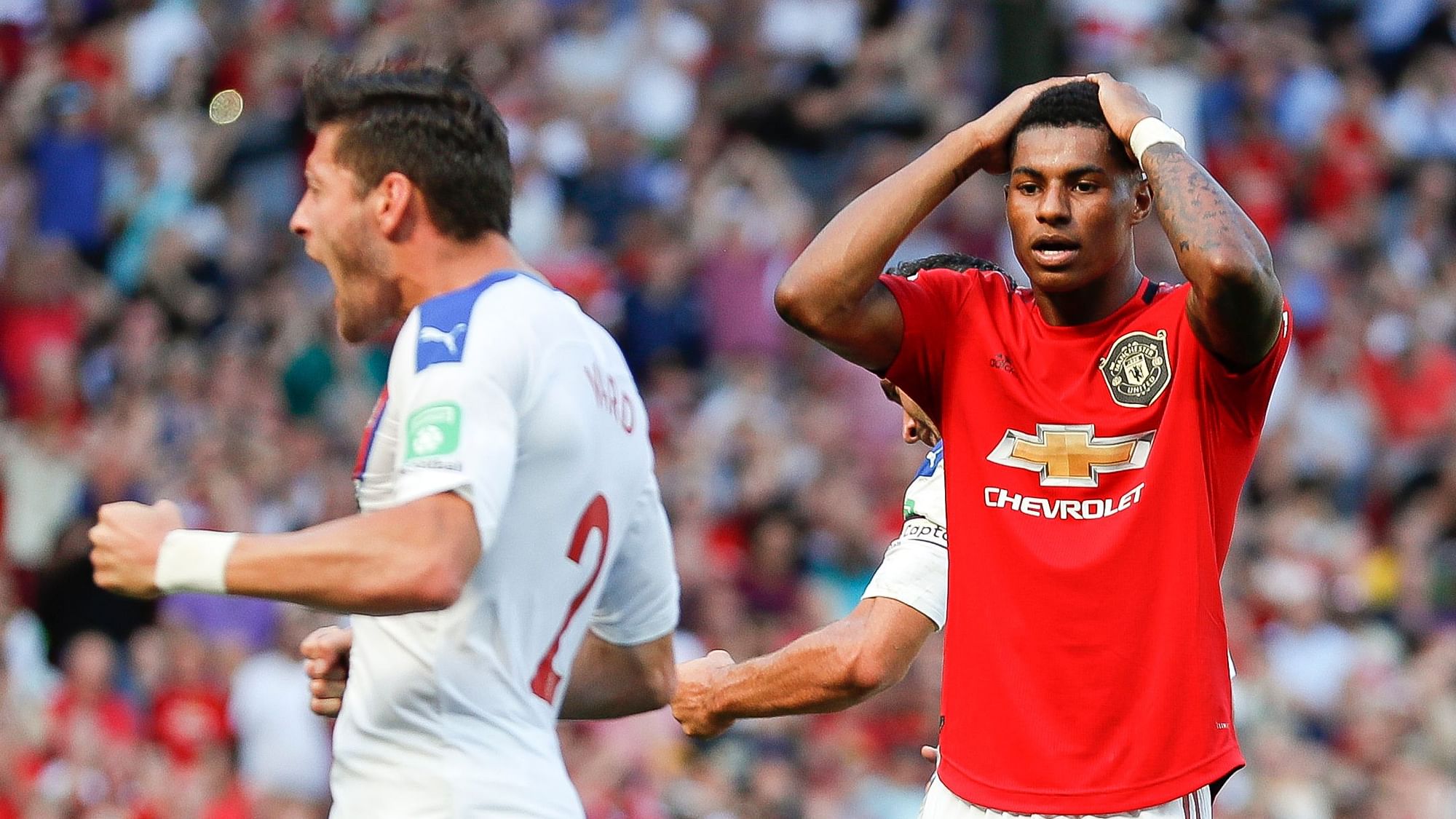 Manchester United’s Marcus Rashford reacts after missing to score on a penalty kick during the English Premier League soccer match.