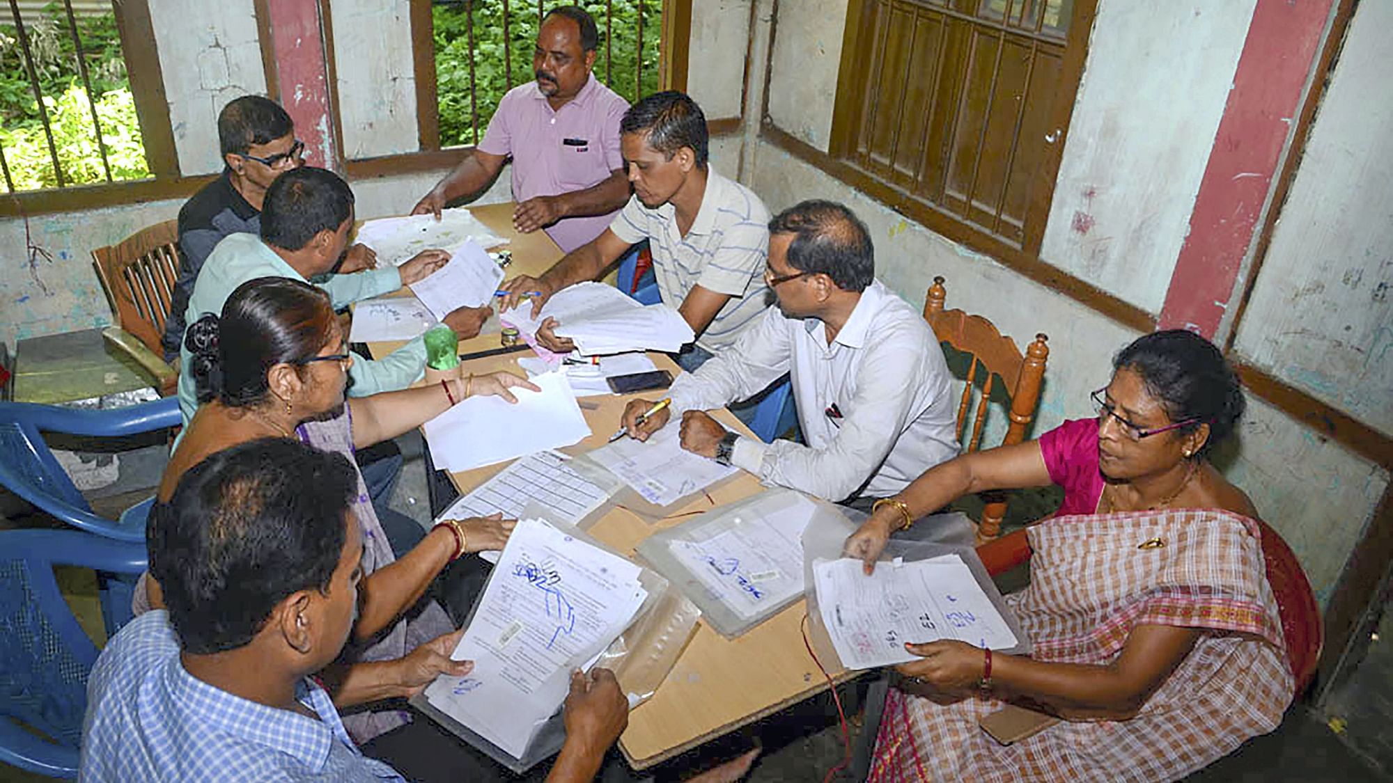 Officials checking documents submitted by people, ahead of the release of the final draft of NRC in Guwahati on Monday.