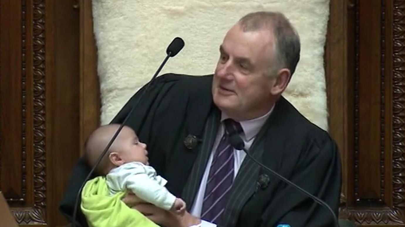 Trevor Mallard holding MP Tamati Coffey’s baby in parliament.