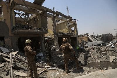 KABUL, Aug. 7, 2019 (Xinhua) -- Afghan security force members inspect at the site of an explosion in Kabul, capital of Afghanistan, Aug. 7, 2019. At least 95 people were wounded after a massive car bomb explosion ripped through a busy neighborhood at the western side of Afghanistan