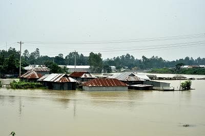 TANGAIL (BANGLADESH), July 18, 2019 (Xinhua) -- Partially submerged houses are pictured in a flood-affected area in Tangail, Bangladesh, on July 18, 2019. Flash floods sparked by heavy seasonal rains affected parts of Bangladesh. (Str/Xinhua/IANS)