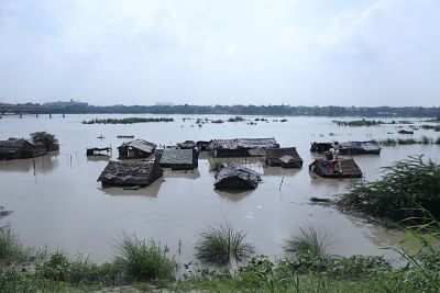 New Delhi: Hutments submerged in the swollen Yamuna river which is flowing above the danger mark with the water level at 206.60 metres, in New Delhi on Aug 21, 2019. (Photo: IANS)