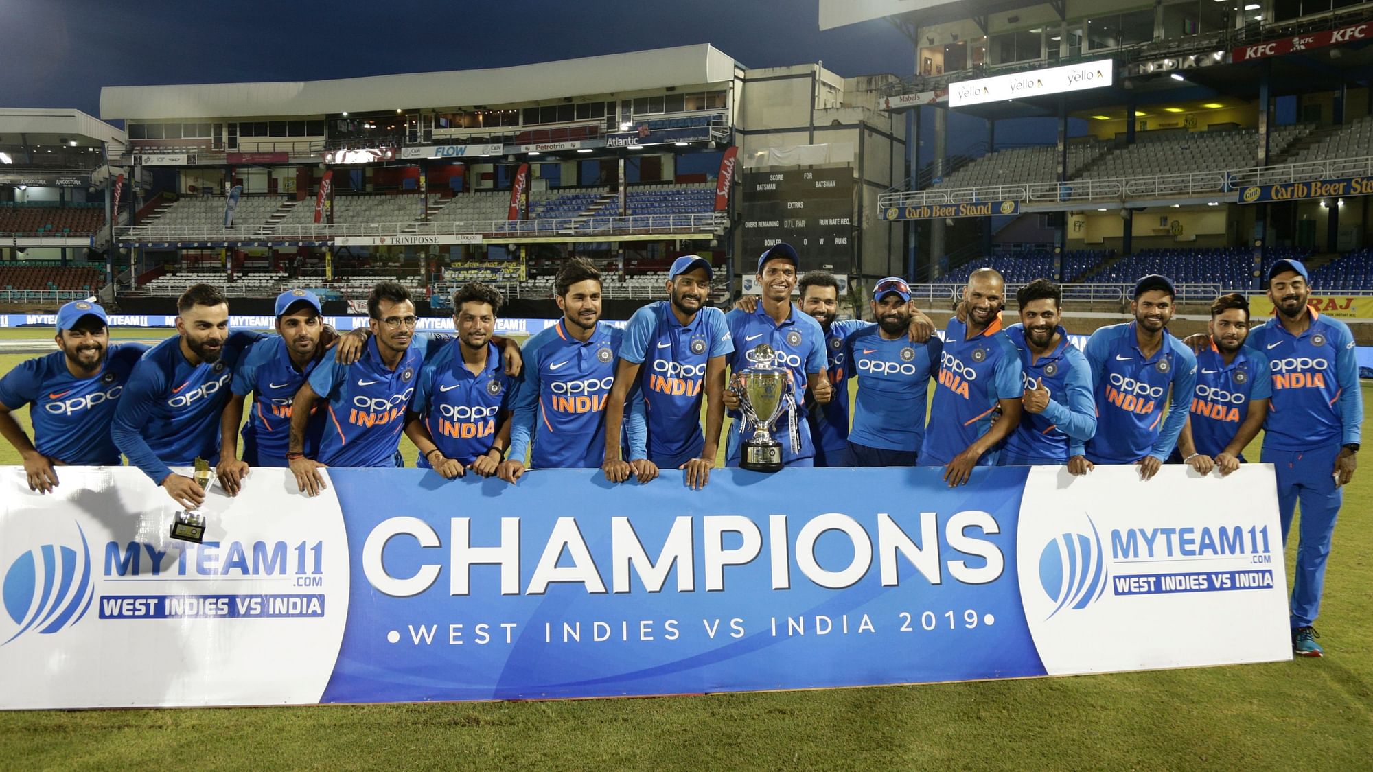 The Indian team pose for a photo after winning the ODI series against West Indies in Port of Spain, Trinidad.