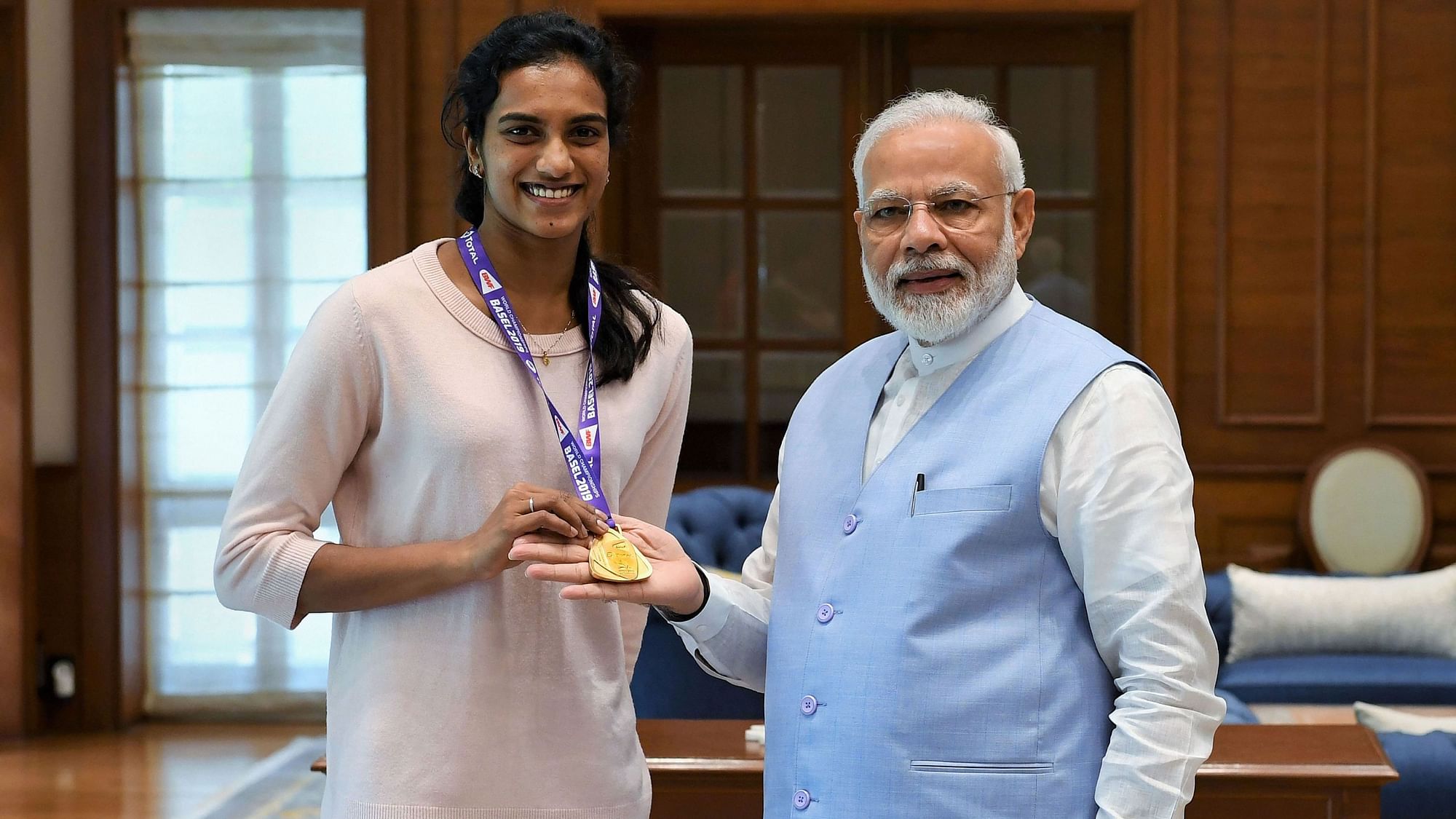  Prime Minister Narendra Modi meets World Champion PV Sindhu in New Delhi on Tuesday, 27 August.