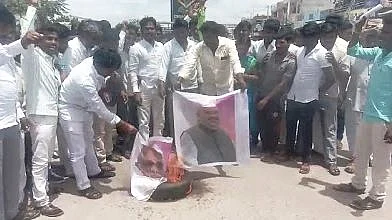 BJP workers in Koppal burn posters of BJP President Amit Shah 