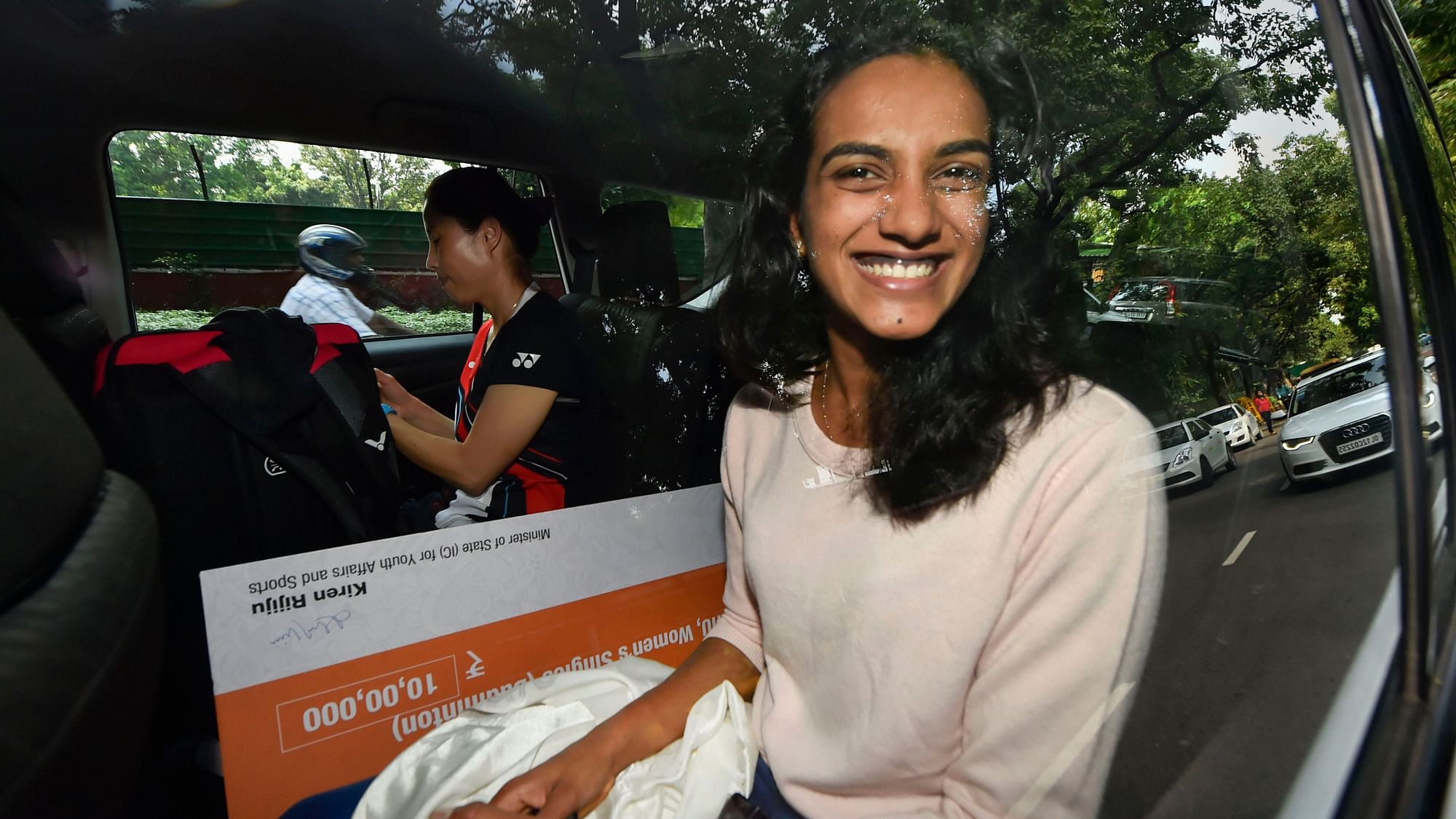 Despite the hectic schedule she has endured, Sindhu had a smile on her face as she acknowledged supporters and the media at the airport.