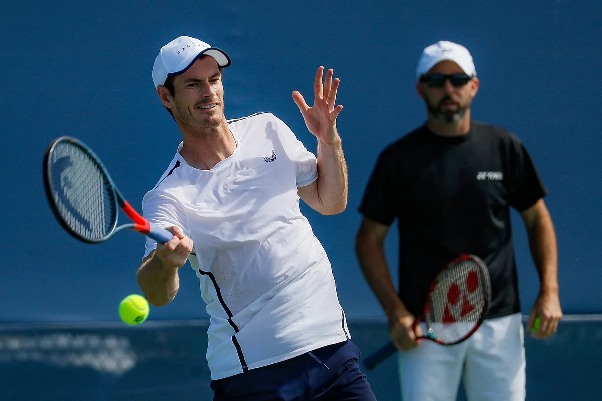 Andy Murray practices as his coach Jamie Delgado, right, at the Western & Southern Open tennis tournament, Sunday, Sunday, Aug. 11, 2019, in Mason, Ohio. 