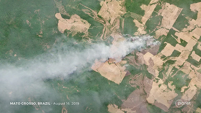 This Planet image shows a fire burning in an area of recent forest clearing in Mato Grosso, Brazil.